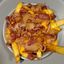 Papas fritas con Queso cheddars y Bacon