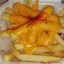 Orden de papas fritas con queso cheddars